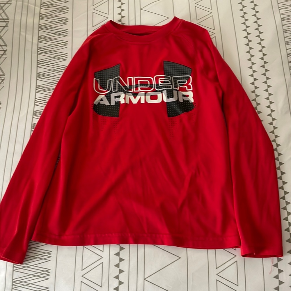 Red UA heat gear boys shirt.